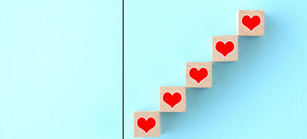 Measuring graph with five blocks with hearts going up measuring graph with five blocks with hearts going up representing progress and measuring love