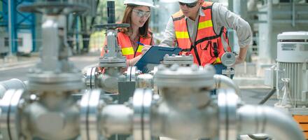 Engineers carrying out inspections Inspection being carried out on pipes